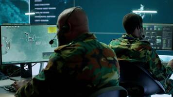 Government intelligence officers in control room manage surveillance operations, analyze real time data and coordinate security measures to protect national interests. Secret service. Camera A. video