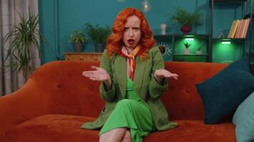 Redhead woman asking why, what reason of failure, demonstrating disbelief irritation by troubles video