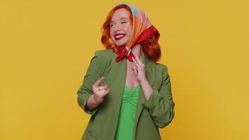 Overjoyed happy girl showing rock n roll gesture by hands, cool sign, shouting yeah with crazy face video