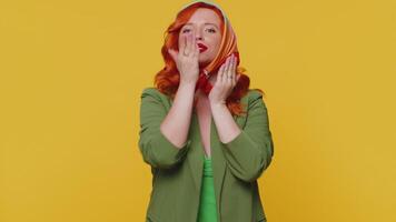Smiling redhead girl sending lots of air fly kisses looking at camera and smiling, missing you, love video