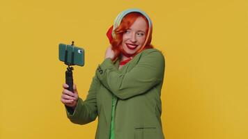 Girl blogger take selfie on mobile phone selfie stick communicate call online with subscribers video