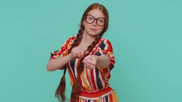 Mime young adult girl pulling an imaginary unreal invisible rope showing how enduring, strong he is video