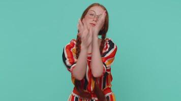 Funny ginger girl making playful silly facial expressions, grimacing, fooling around showing tongue video