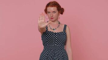 Girl say No, hold palm folded crossed hands in stop gesture, warning of finish, prohibited access video