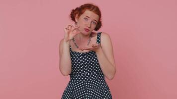 Girl showing a little bit gesture with sceptic smile, showing minimum sign, measuring small size video