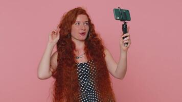 Girl blogger take selfie on mobile phone selfie stick communicate call online with subscribers video