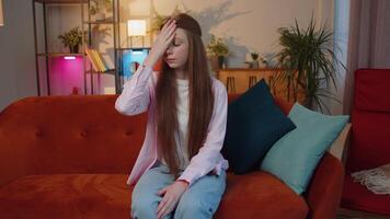 Upset redhead girl making face palm gesture, feeling bored, disappointed in fail bad results news video