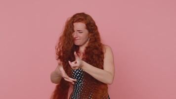 Mime young woman pulling an imaginary unreal invisible rope showing how enduring, strong she is video