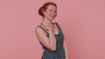 Smiling playful happy redhead woman blinking eye, looking at camera with smile, winking, flirting video