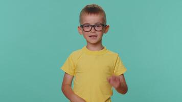 Happy toddler children boy smiling friendly at camera and waving hands gesturing hello or goodbye video