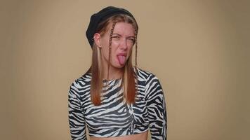 Girl showing tongue making faces at camera, fooling around, joking, aping with silly face, teasing video
