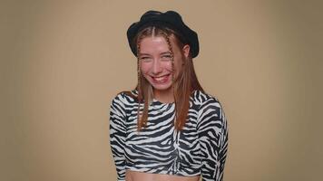 Smiling playful happy girl blinking eye, looking at camera with smile, winking, flirting, optimism video