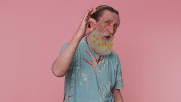 Senior man looking approvingly at camera showing ok gesture, like sign positive, approve good video