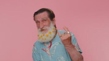 Overjoyed happy man showing rock n roll gesture by hands, cool sign, shouting yeah with crazy face video