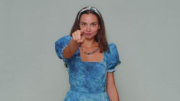 Pretty young woman pointing to camera and looking with playful happy expression, making choice video