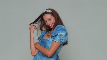 Smiling playful happy girl blinking eye, looking at camera with smile, winking, flirting, optimism video