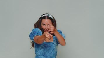 Lovely pretty young strong woman mime pulling an imaginary unreal invisible rope, puts lot of effort video