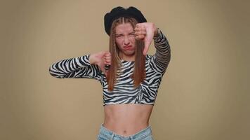 Upset woman showing thumbs down sign gesture, expressing discontent disapproval dissatisfied dislike video