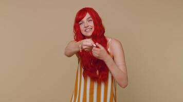 Mime young adult woman pulling an imaginary unreal invisible rope showing how enduring, strong he is video