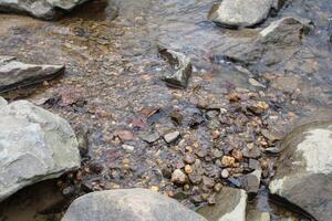 Surface Water Flowing Over Rocks In A Creek In The Rural Countryside photo