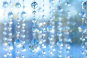 Sparkling crystal bead curtain catching sunlight, creating vibrant reflections and a dreamy ambience photo