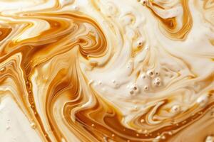 Swirls of coffee and cream blending together. Abstract pattern of warm tones photo