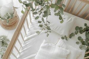 Top view of a minimalist crib with white bedding. Baby nursery setup photo