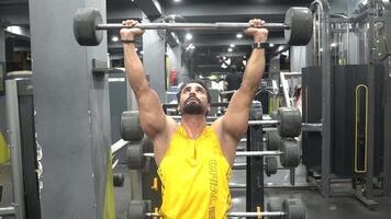man doing exercise with heavy bar video