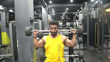 A Boy doing exercise with heavy bar video