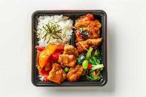 Colorful Bento Box with Teriyaki Chicken and Rice. photo