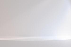 A white room with a white wall and a white floor. The room is empty and has a very clean and simple look. photo