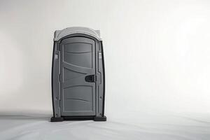 An isolated portable WC unit stands tall against a minimalistic backdrop, showcasing a sleek design perfect for various outdoor events. photo