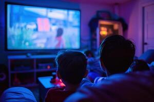 An audience is captivated in a dimly lit theater as they watch a mesmerizing performance unfold before them. photo