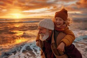 A grandfather carries his joyful grandchild on his back as they walk along the sandy beach at sunset. The waves gently lap at the shore as the two share a moment of pure happiness. photo