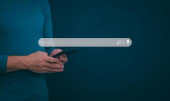 Information search technology, search engine optimization, male hand using a smartphone to search information, using the search bar function on your website photo