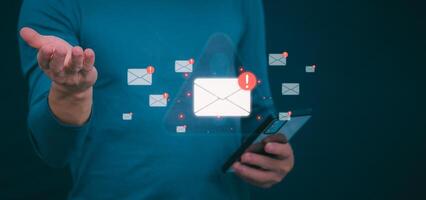 people use their mobile phones to check their daily newsletters or emails that are full of phishing messages. For communication or receiving various news in the Internet age photo