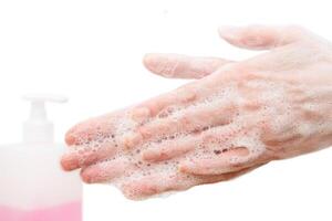 Antibacterial soap in the hands. Hand disinfection with soap. Cleanliness and hygiene in everyday life. Hand hygiene photo