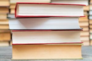 Stack of books in the library. Symbol of knowledge and learning. photo