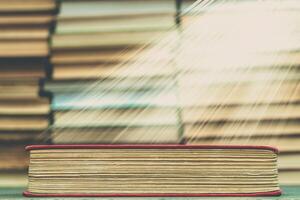 Old book in the red obnozhka. Symbol of knowledge and learning. photo