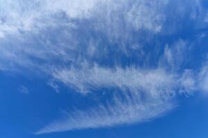 White clouds in the blue sky. Atmospheric phenomenon. photo