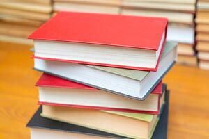 Stack of books in the library. Symbol of knowledge and learning. photo