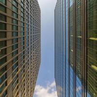 Modern skyscrapers - high-rise buildings in the down town. Bottom view. photo
