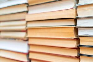 Rows of books in the library. Background for text. Symbol of knowledge and learning. photo