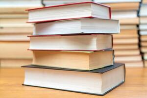 Stack of books in the library. Symbol of knowledge and learning. photo