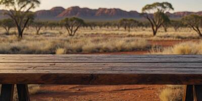 The empty wooden table top with blur background of Australian outback Exuberant image. . photo