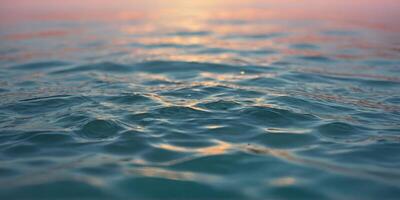 The surface of the water on a soft pastel background gives a feeling of calm. photo