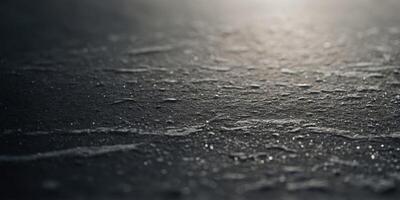 A close-up of a hockey puck with skate marks etched into its surface. photo