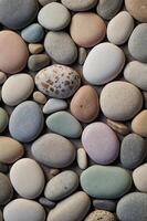 A highresolution image showcasing a serene background of smooth, rounded pebbles in soft, pastel hues, embodying a minimalist and aesthetic concept perfect for calm and soothing designs. photo