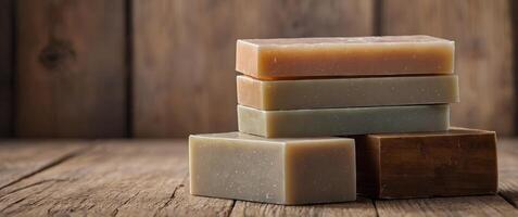 A stack of soap bars arranged neatly on a wooden block. photo