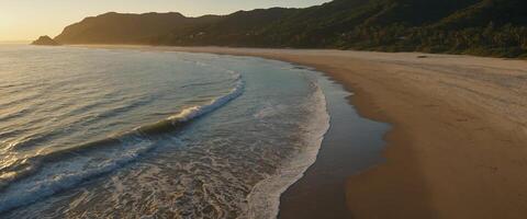 Behold the captivating beauty of a secluded beach at dawn, where the first light of day bathes the landscape in a soft, golden glow. photo